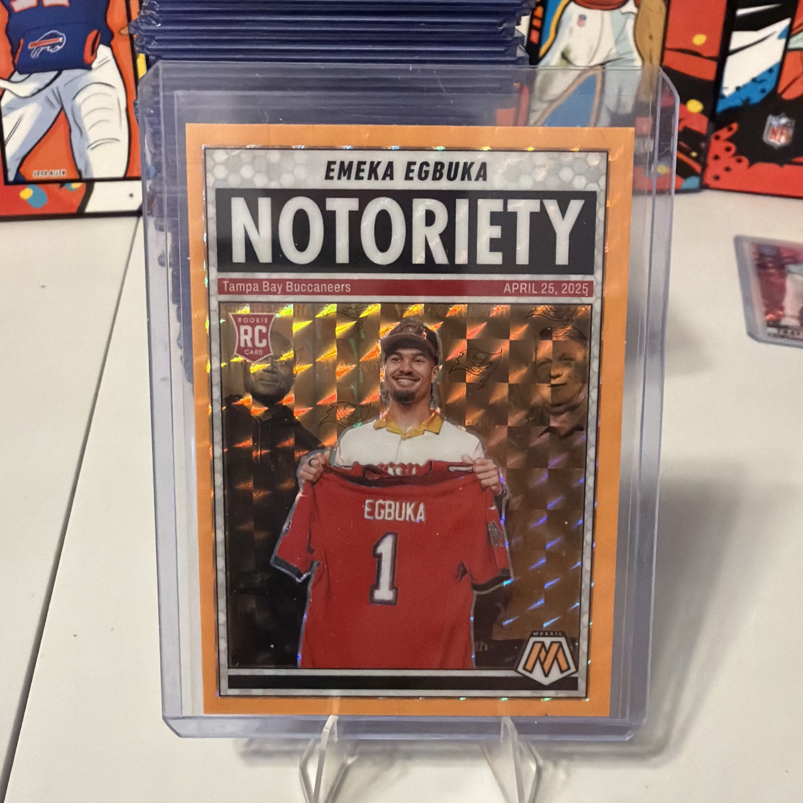 2025 Panini Mosaic Notoriety Emeka Egbuka #16 Orange Fluorescent Mosaic Prizm RC