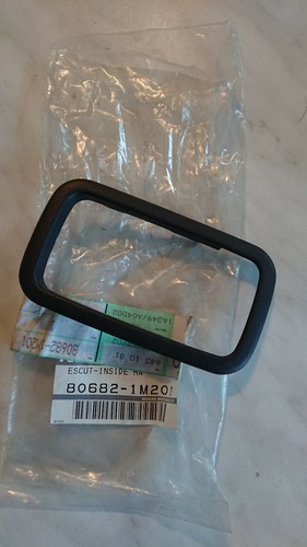Nissan Almera N15, interior door pull handle surround, Trim code G, new genuine.