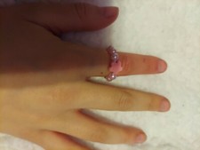 homemade ring with light pink pearls and a salmon flower shaped bead small