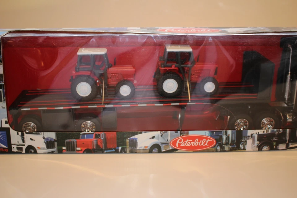 New Ray Peterbilt Flatbed Semi with Farm Tractor Load 1/32 Scale Boxed - Image 3 of 4