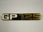 SUZUKI GP 125 '78, - '81  SIDE COVER BADGE, NEW CAST REPRODUCTION.