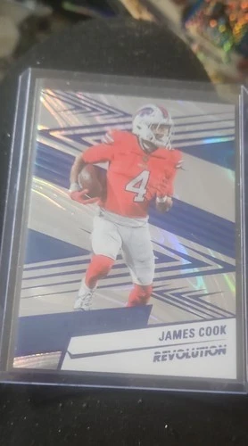 2025 Panini Revolution Football Blue Swirl James Cook #112