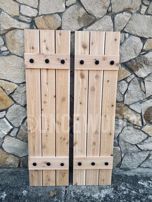 Board and batten rustic cedar shutters sold by the set with clavo hardware