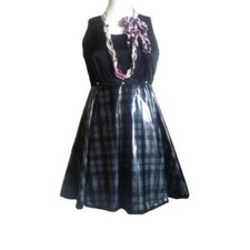 Vintage Gianni Versace black and check pattern vinyl dress with medusa motifs.