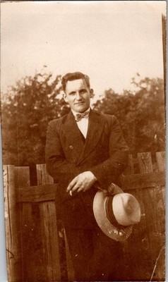 Vintage Sepia Photograph Man in Suit Bow Tie Holding Hat & Cigarette Outdoor