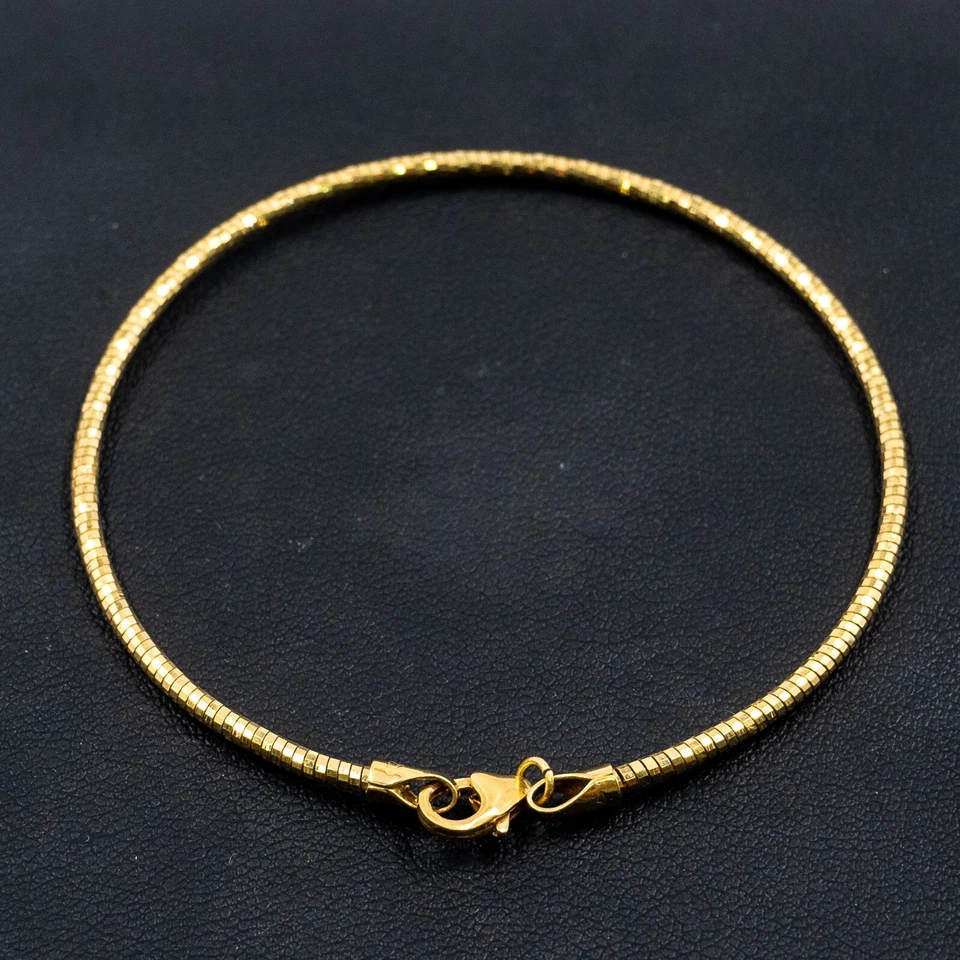 Brazalete redondo de oro amarillo de 18k Foto 2 de 4