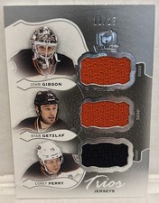 Gibson Getzlaf Perry 11/25 Trios Jerseys 2016-17 The Cup Hockey NHL Card