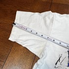 White Reebok Runners T shirt with single stitch, measuring approximately 3 inches from the side seam to the hem.