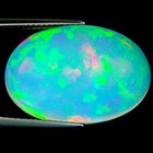 9.21 Ct IGI Certified Natural Ethiopian Cabochon Opal Multi Color Oval Cut — photo 1