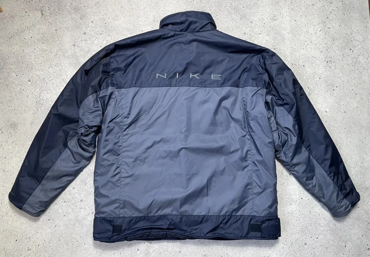 Vintage Nike down jacket with large Y2K logo