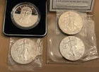 4 Silver rounds - 3 - 1oz Silver Liberty American Eagle Dollars & 1 - U.S. MINT