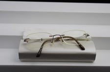 Charmant Line Art Ladies titanium rimless eyeglasses; Model XL2001 color BR