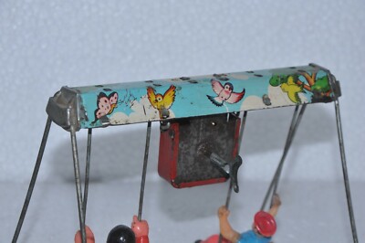 Vintage Colorful Double Swing With Clock Wind Up Tin Toy