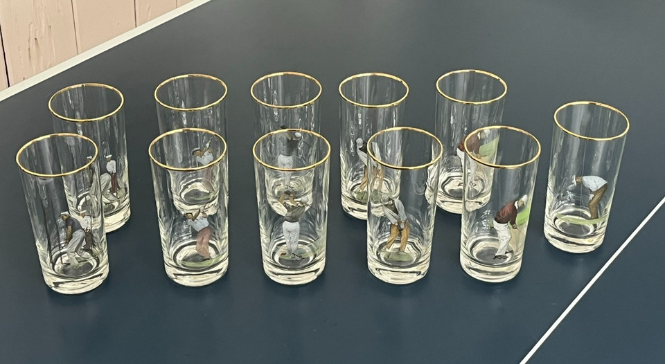 A set of 11 gold-trimmed highball glasses with MC Weiler golfer prints — rare sporting barware that doubles as vintage art you drink from.