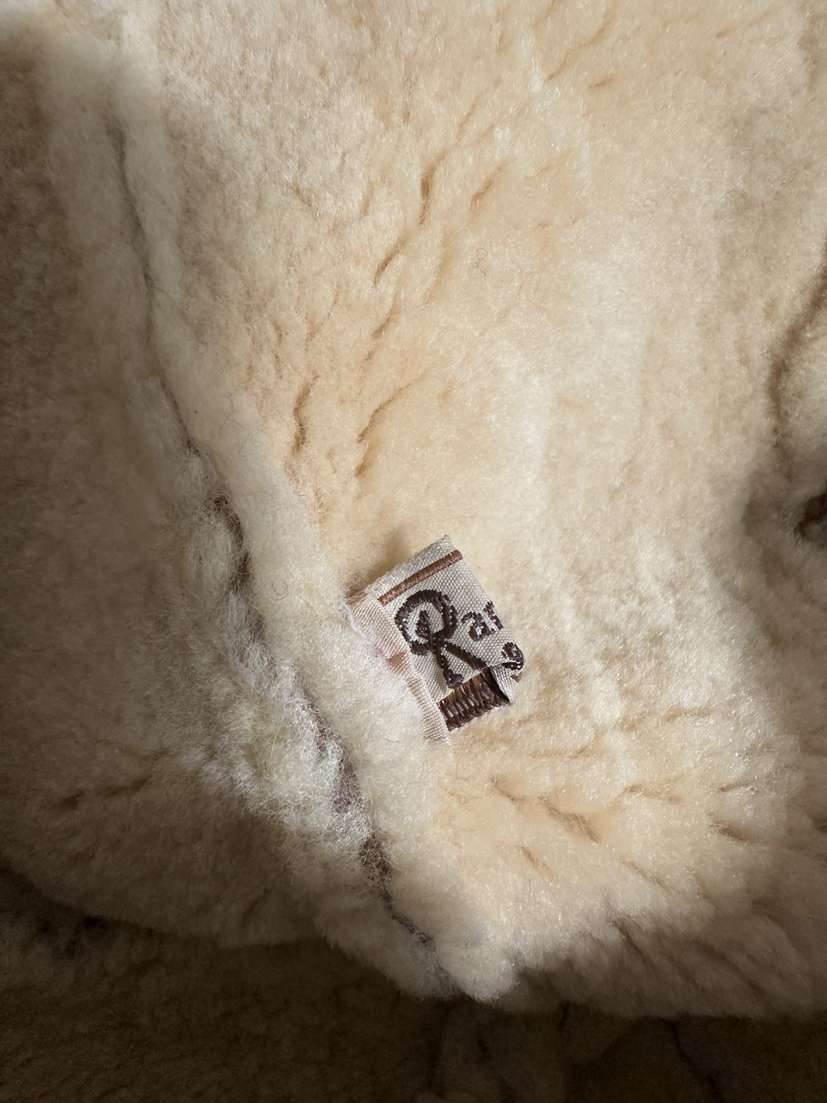 Brown suede vintage ranchero bucket hat with cream shearling lining and small rectangular tag reading “Ranchero Made in USA.”