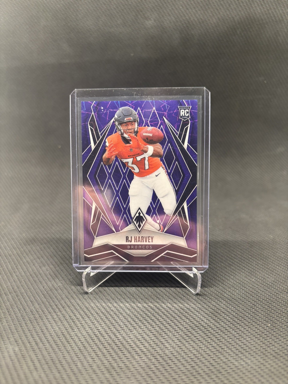 2025 Panini Phoenix - Rookies RJ Harvey #176 (RC) Purple Laser /99