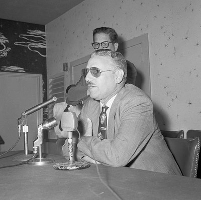 Carlos Prio Socarras former president of Cuba at a press conferen- 1956 Photo