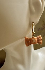 Authentic Authentic Vintage Chanel Gold Plated Peach Bow Resin Dangle Earrings
