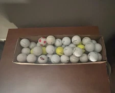 65 golf balls, used, multiicolors, multiple brands 