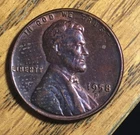 1958-D lincoln cent with die crack on bottom left of D to Lincoln chest.