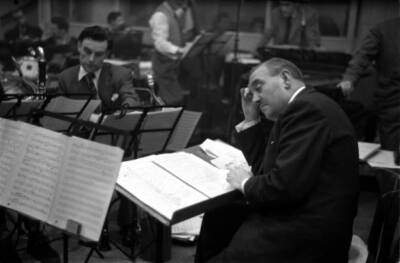 Ted Heath goes over a score with his band at a recording session 1950s Old Photo