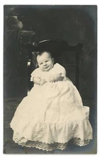 RPPC Cute Baby in Dress on Chair Studio Portrait Real Photo Postcard
