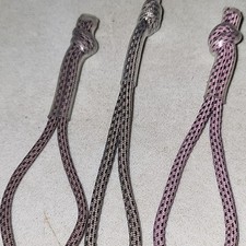 3 types of pink nike elite tags
