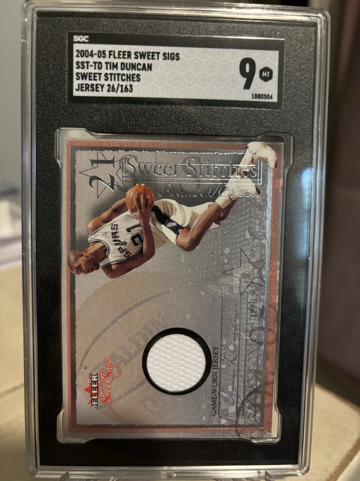 2004-05 Fleer Sweet Sigs Tim Duncan Sweet Stitches Game-Worn Patch PSA-9 #/163
