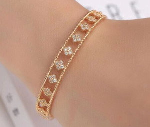 Authentic 2.00Ct Moissanite Set Four Clover Leaf Bangle Bracelet in 14K Yellow Gold Plated