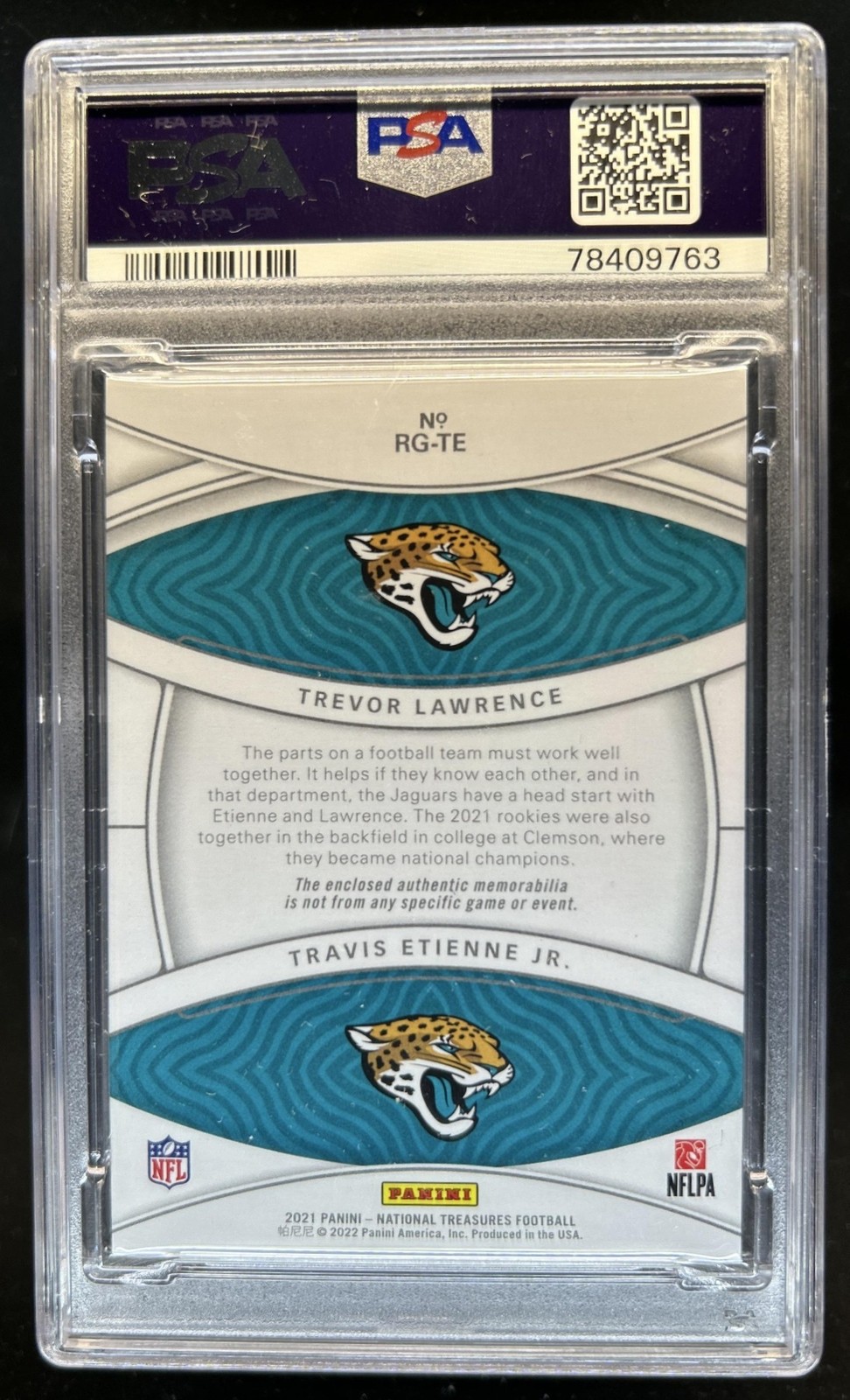 2021 National Treasures Travis Etienne Trevor Lawrence Rookie Jersey #/99 PSA 10 view 2