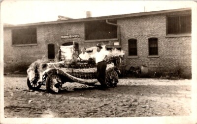 RPPC Postcard Woman Driving Decorated Car Parade Float Holmes Grocery Sign 12558