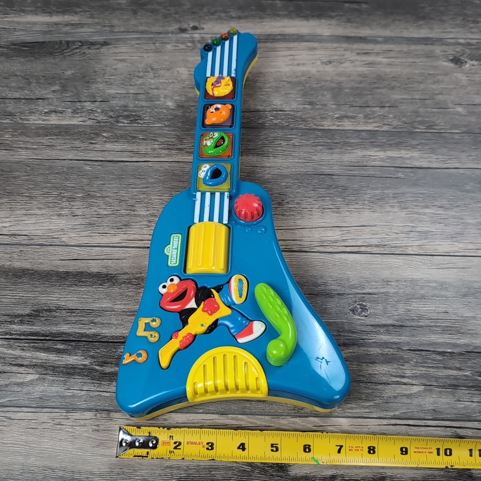 Peluche vintage Elmo Rock & Roll avec guitare – Sesame Street