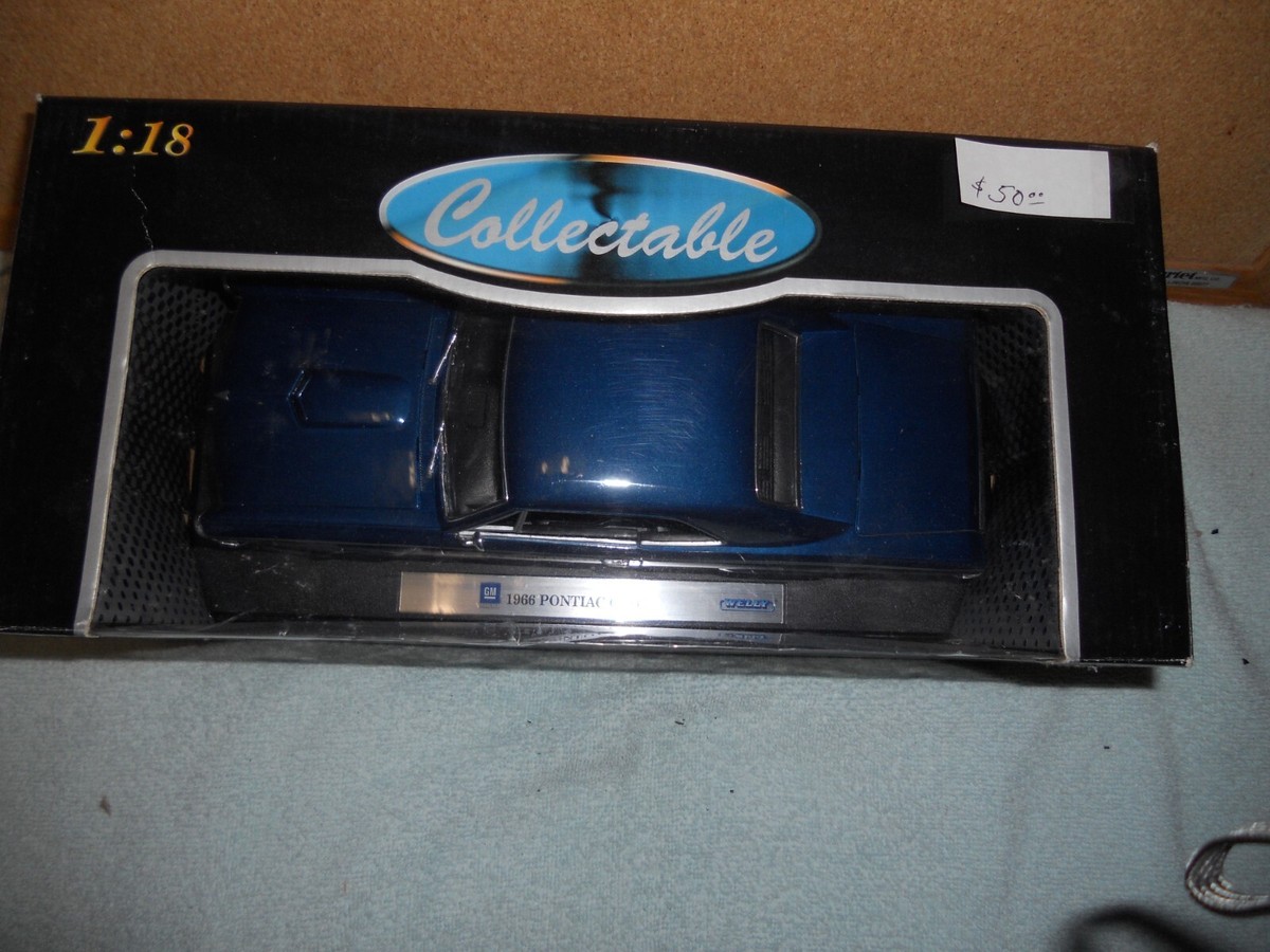 WELLY★1966 ポンティアック GTO Welly - Pontiac GTO (1966, 1:18, Gold) 9856 - Toy Wonders, Inc.