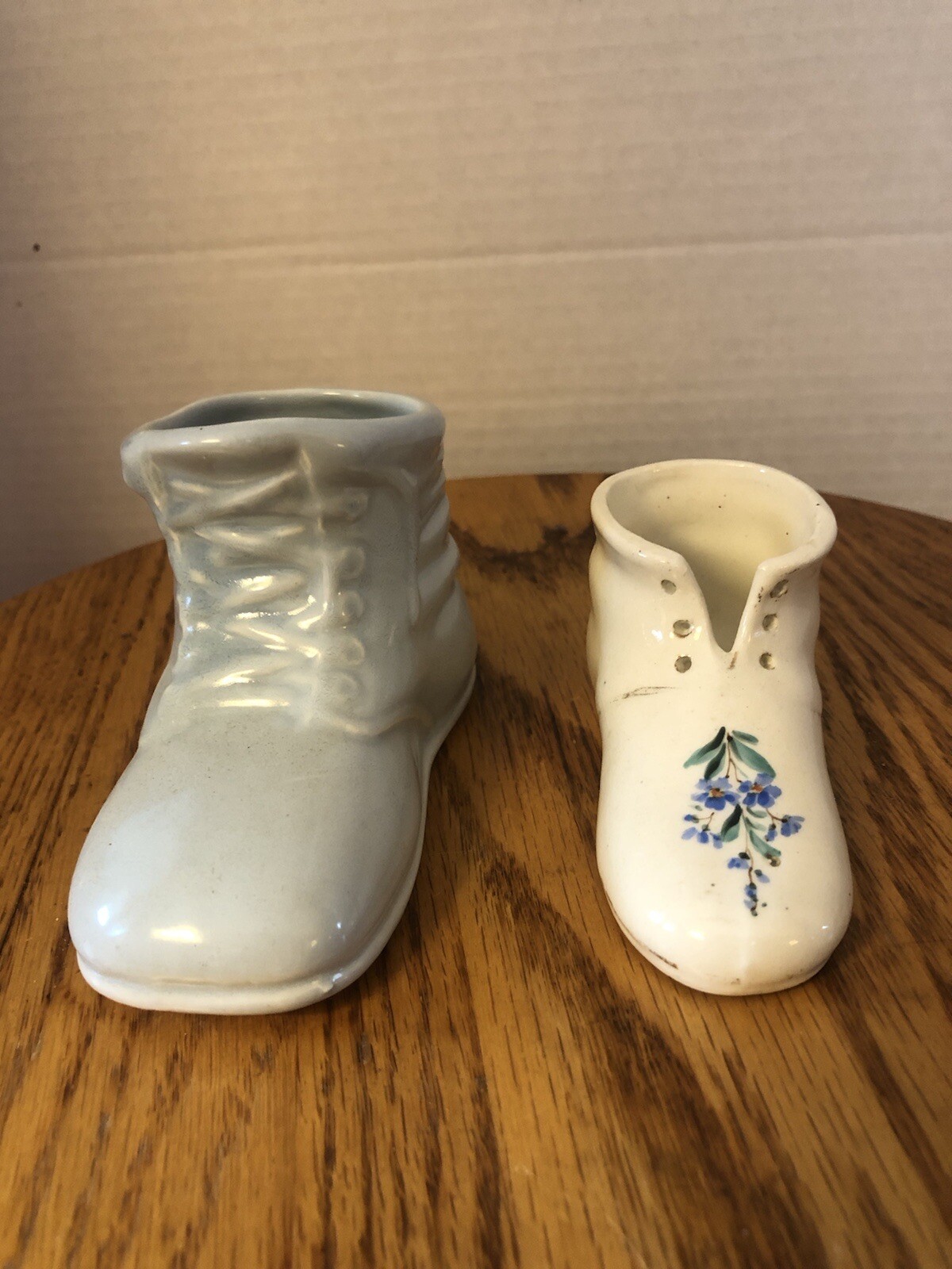 Two Vintage Ceramic Baby Shoe Figurines.