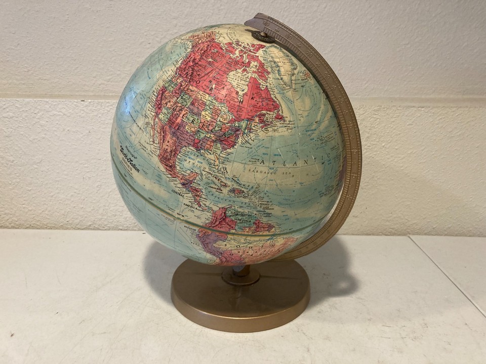 A 12-inch Replogle World Nation globe on a solid wood base — a proper vintage American-made desk globe that looks expensive at a bargain price.
