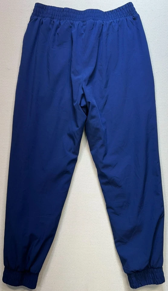 Pantalones de chándal para hombre Asics forrados de lana talla mediana azul bolsillos con cremallera al aire libre Foto 2 de 4