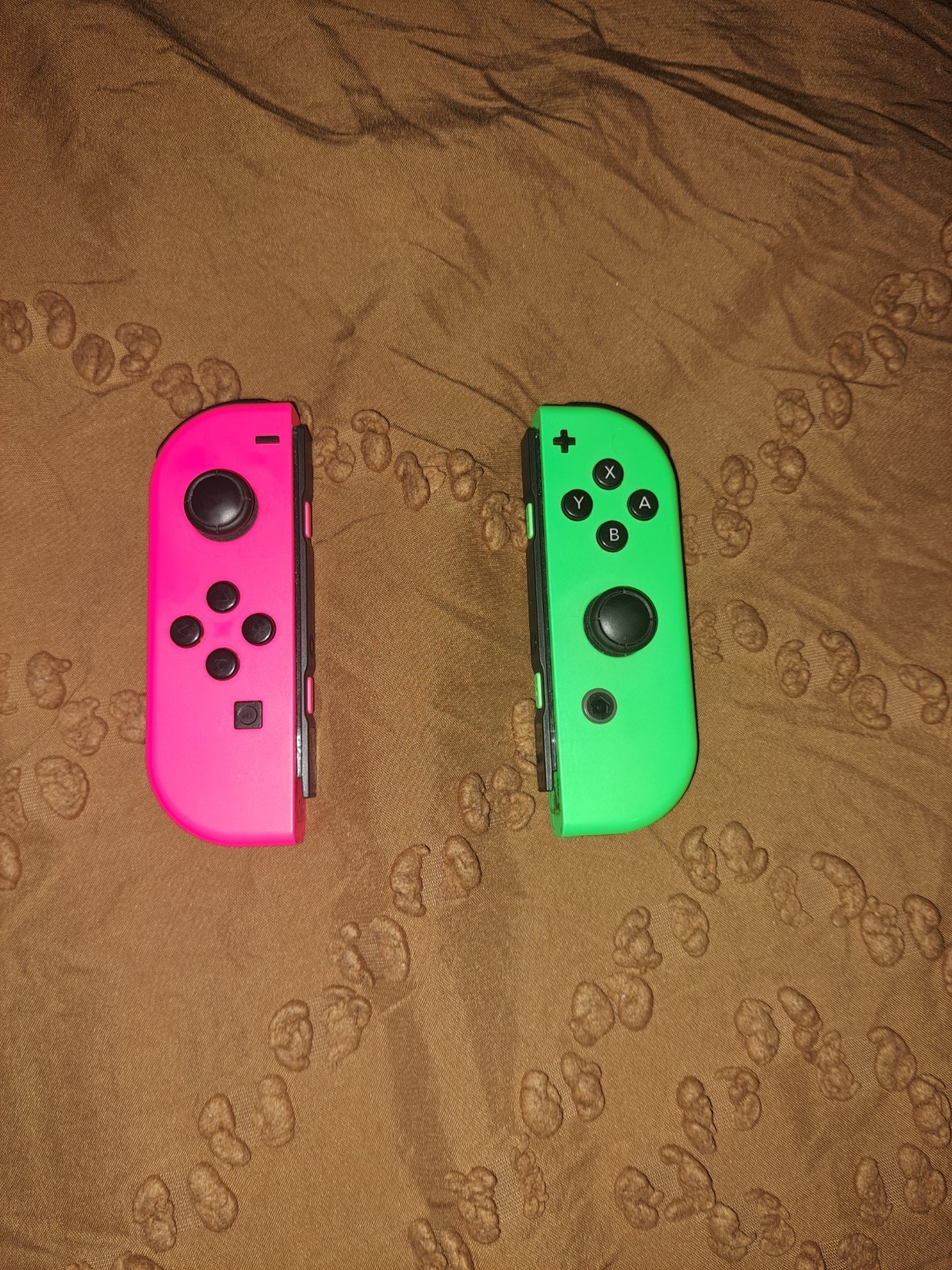 Pink and Green Nintendo Switch Joycon Controllers