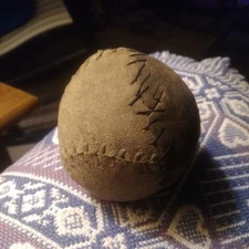 antique baseball with vintage repair