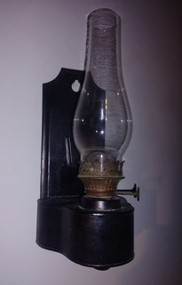Antique oil filled wall hanging lamp with glass shade
