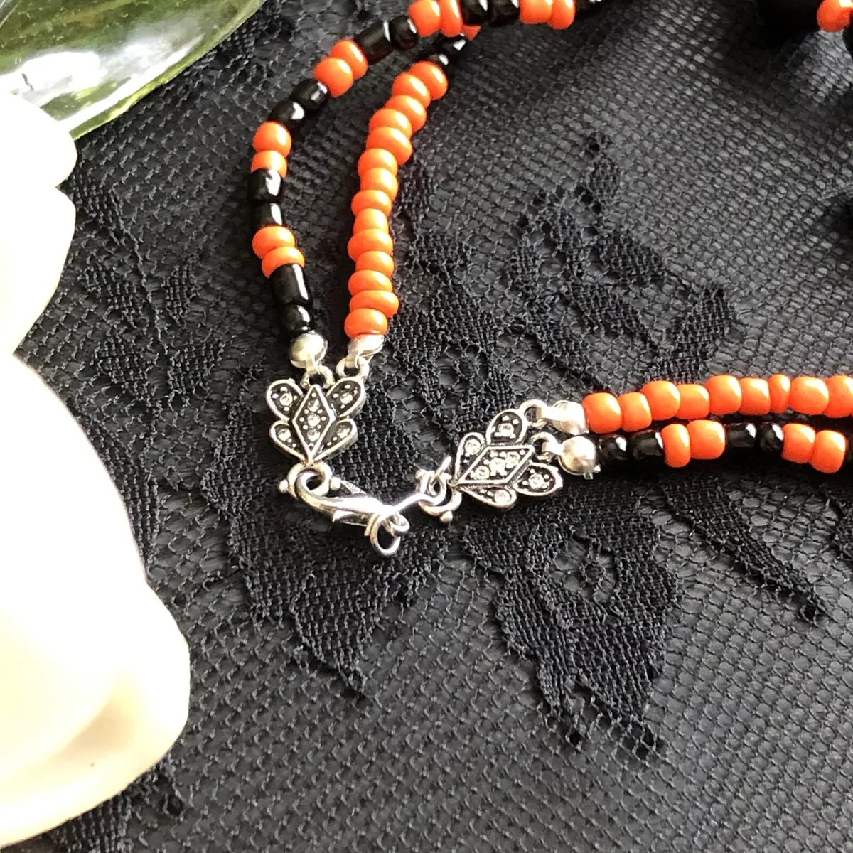 Orange and shop black jewelry