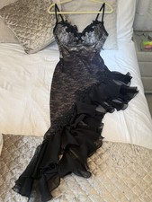 Black evening wear gown with a distinctive corseted and ruffled style size 8-12