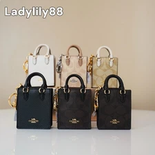 NWT Coach CU280 CU281 CX069 North/South Mini Tote Bag Charm In Signature Canvas