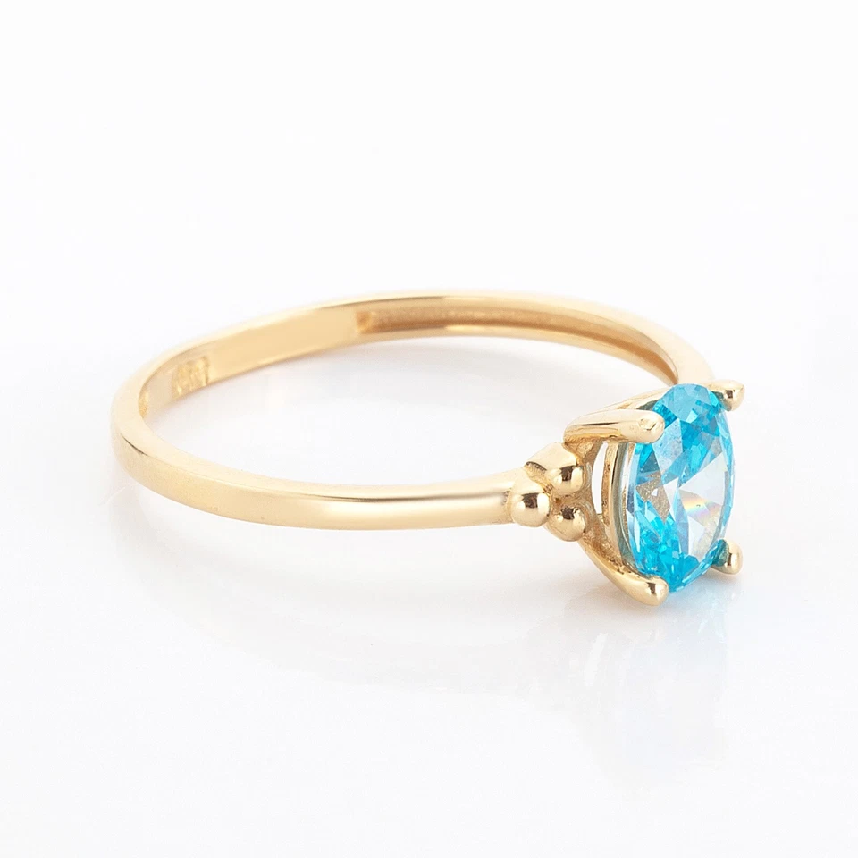 Anillo ovalado de oro amarillo de 14k con piedra aguamarina Foto 4 de 4