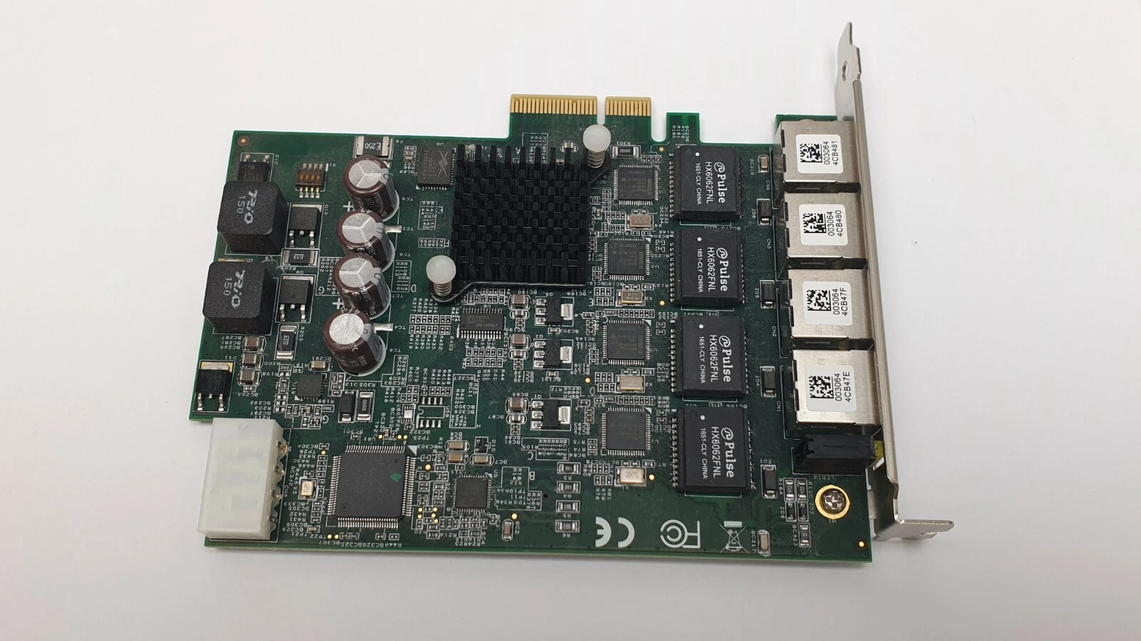 Top view of the ADLINK PCIe-GIE64+ card with heat sink, Pulse magnetics and 4-pin power connector