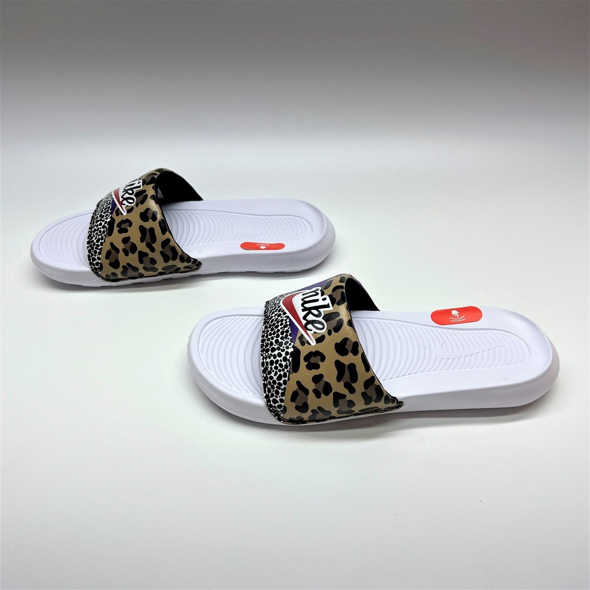 nike leopard sliders