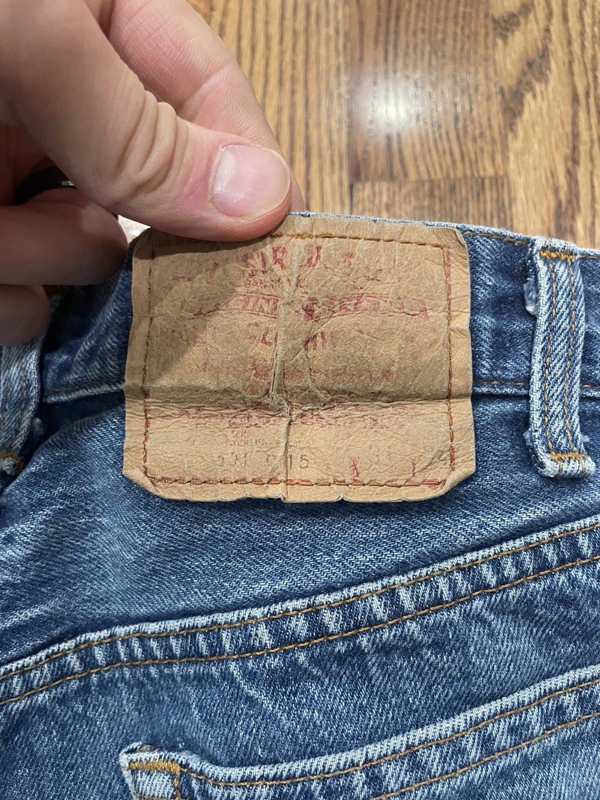 Tan leather Levi’s 501XX patch, blue denim, red “Made in U.S.A.” tag, 31x34.