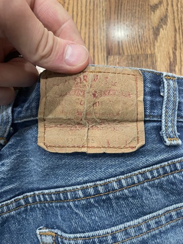 Tan leather Levi’s 501XX patch, blue denim, red “Made in U.S.A.” tag, 31x34.