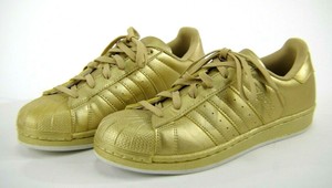 gold adidas shell toes