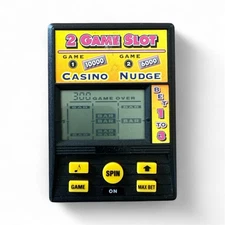 RADICA 2 GAME SLOT CASINO NUDGE MODEL 1374 CS2BA ONE PLAYER W/ 2 SLOT HANDHELD