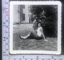 Young Woman Sitting in Grass Posing Fashion Risque View Photo Snapshot